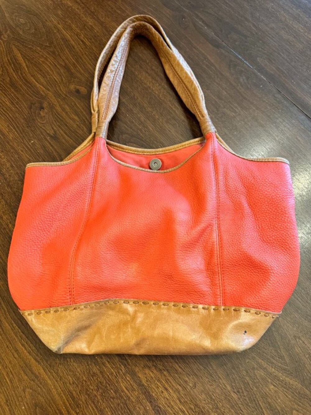 The Sak Large Coral Orange Pebbled Leather Hobo Shoulder Bag-wear as seen